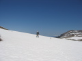 Rob crests the saddle, taking in the view